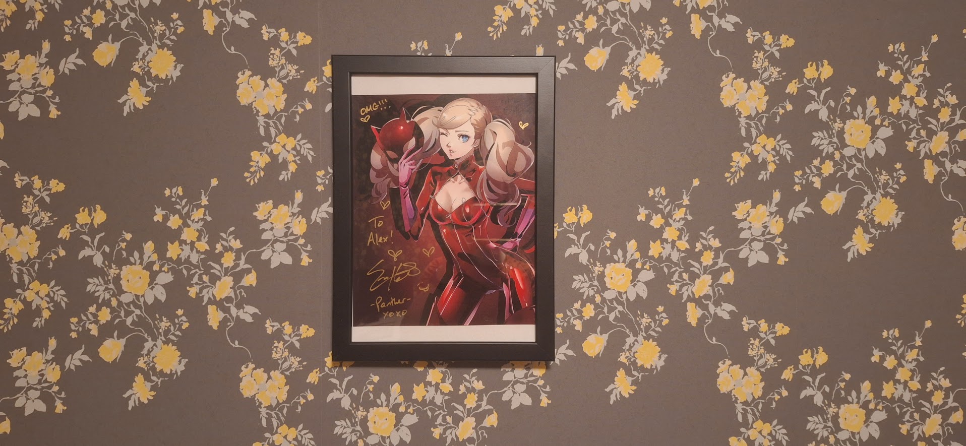 A print of Ann Takamaki from Persona 5, signed by her English voice actress
Erika Harlacher