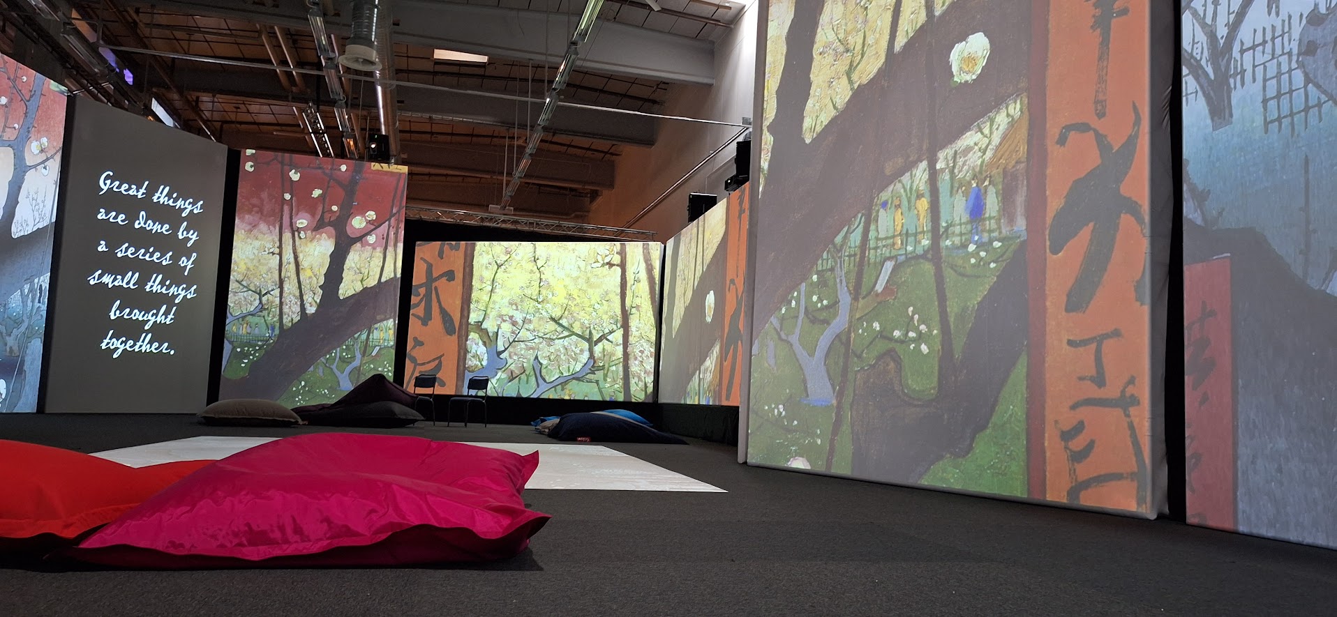 A room with van Gogh paintings projected on
screens